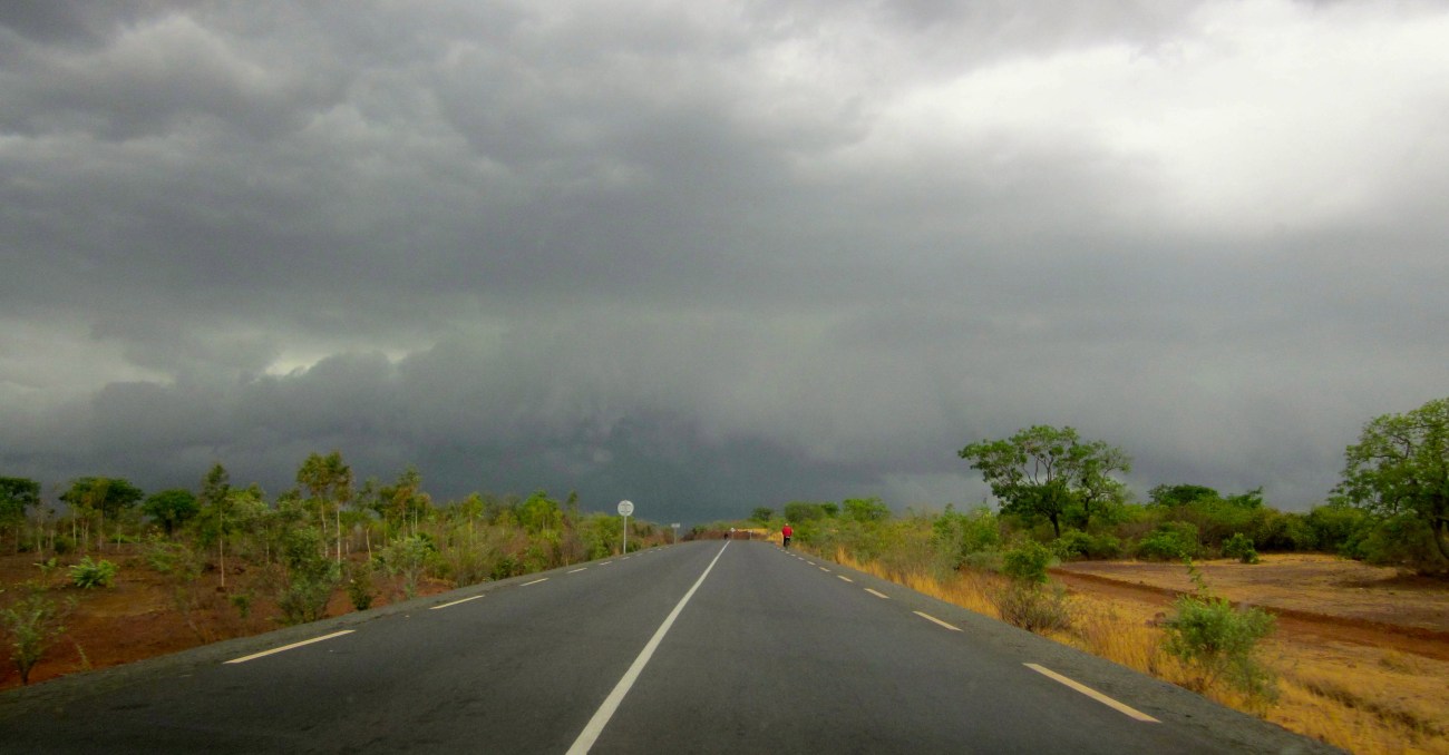 Mali rural road storm cloud grey sky rain drought