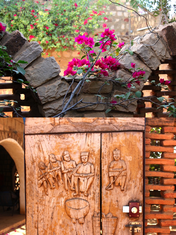 Mali Mopti Bandiagara traditional stone architecture wall bougainvillea flower