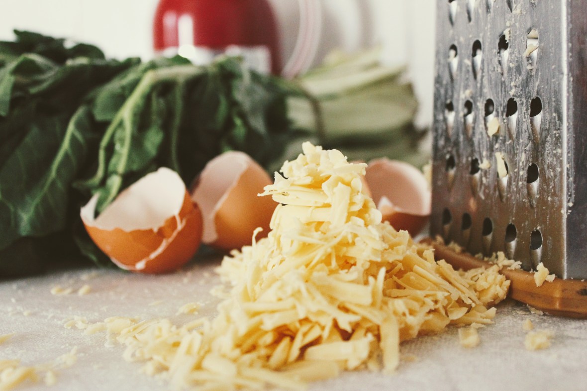 spinach egg shell shredded cheese grater counter